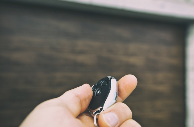 man-is-opening-garage-door-by-remote-controller