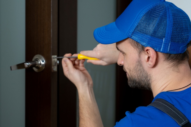handyman-repair-door-lock-room-closeup-man-repairing-doorknob